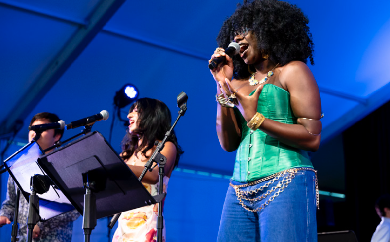 students singing on stage